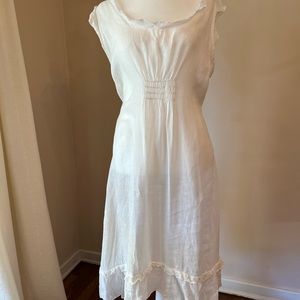 CP Shades white linen sundress. Darling and sexy without being overt.